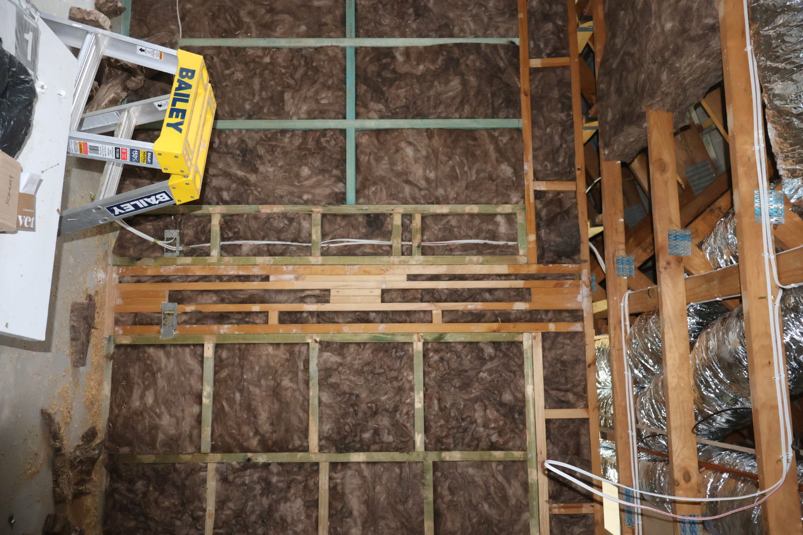 Wall frame with insulation batts installed between studs, Thermotech Insulation