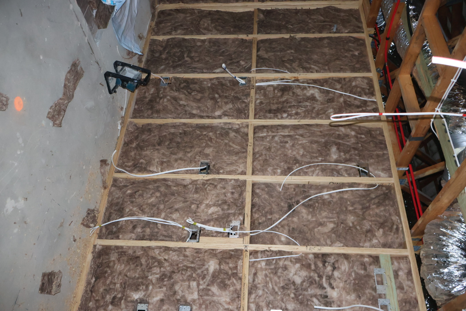 Wall insulation batts fitted into timber framing, NSW