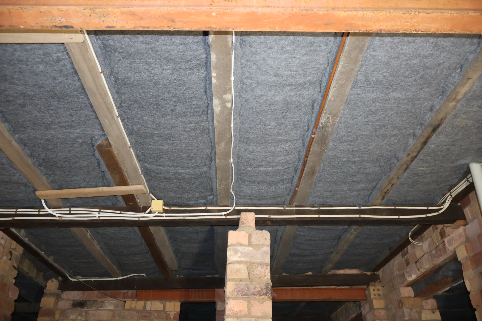 Underfloor insulation installed between floor joists